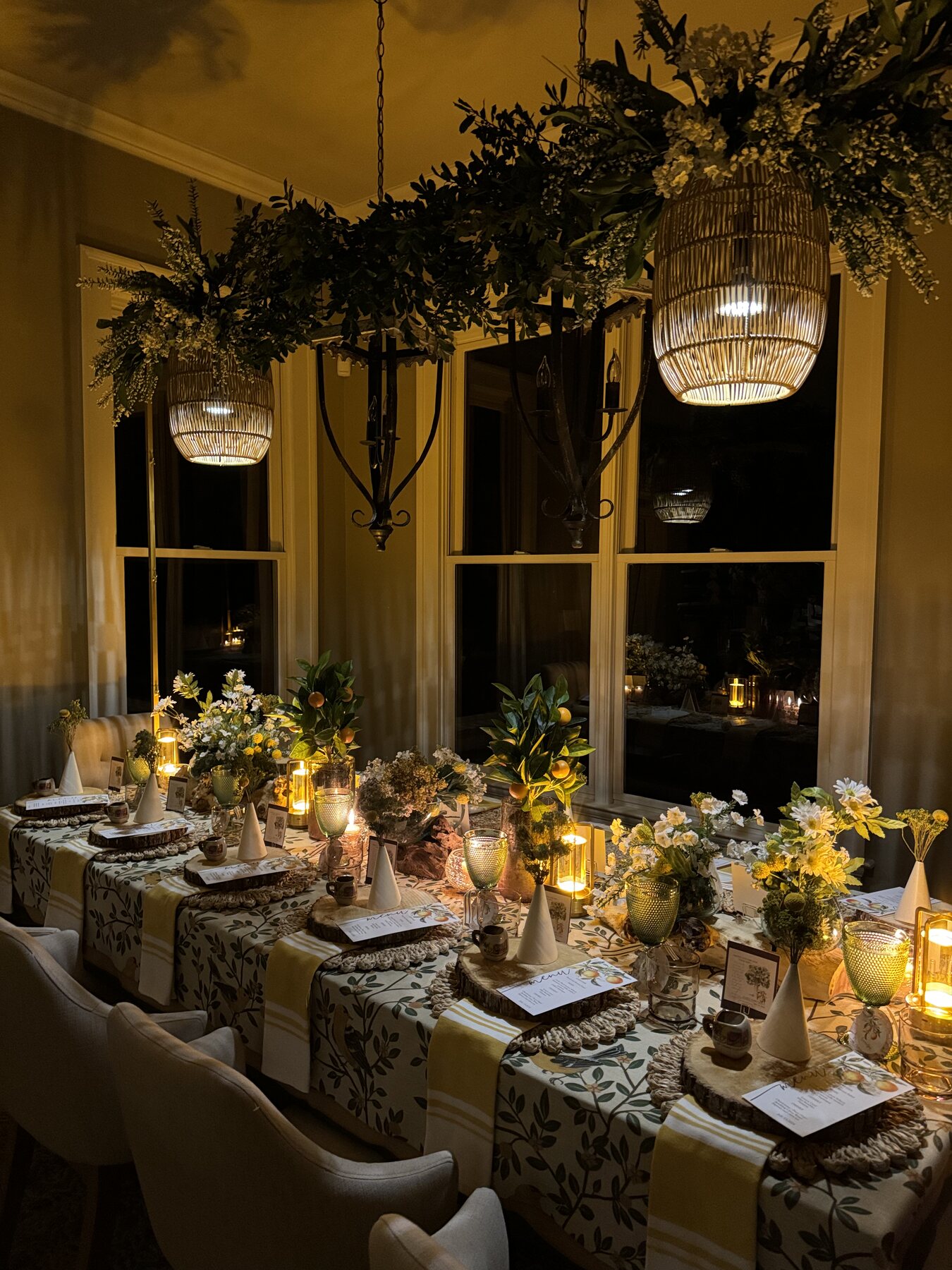 Candlelit evening tablescape with botanical pattern and warm glass